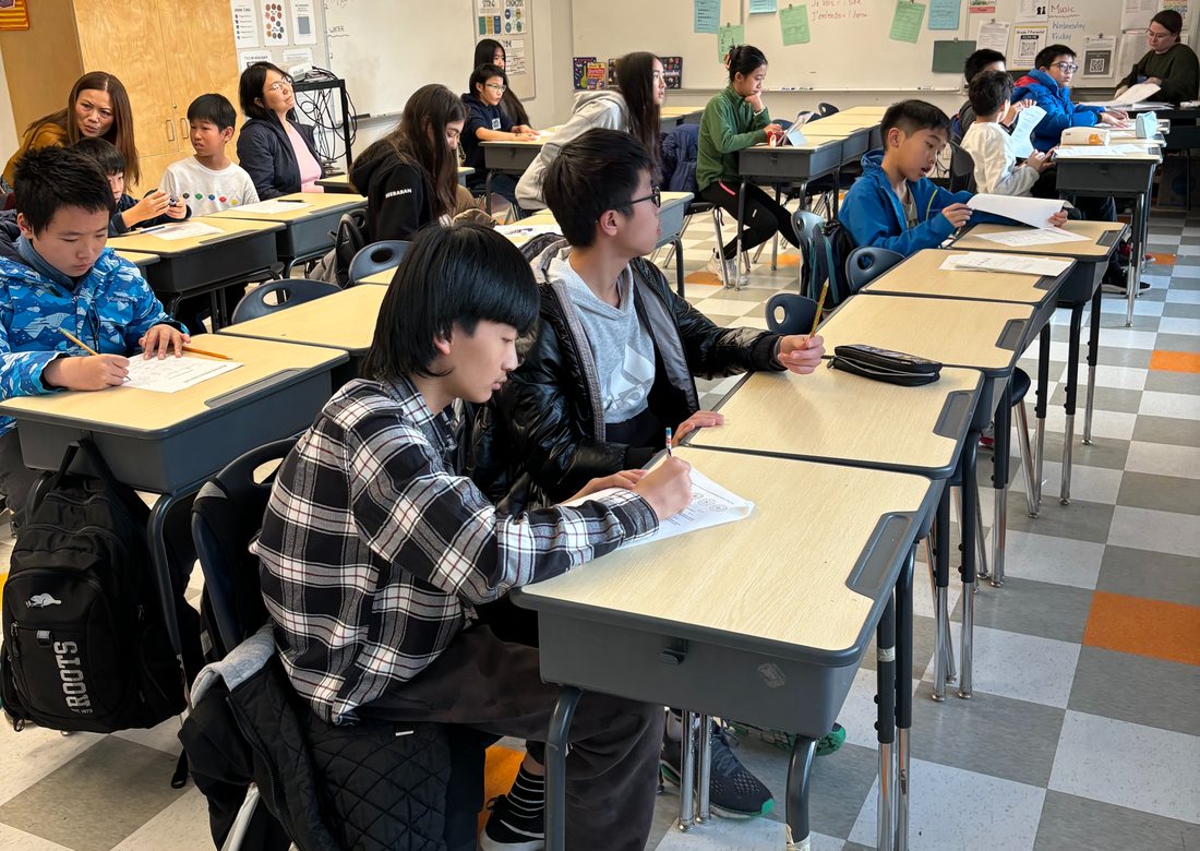 Students in a Hands of Youth classroom tutoring session